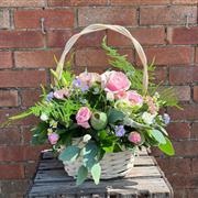 A basket of florist choice in pastels