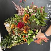 Florist choice of red, orange and yellows