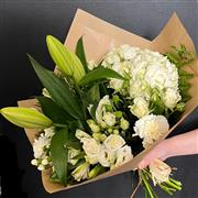 A hand tied of florist choice whites &amp; greens