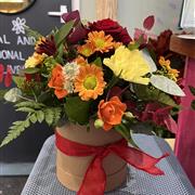 Hat box in oranges and yellows